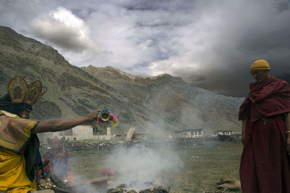A monk and a Tibetan witch doctor praying together in Rupshu valley