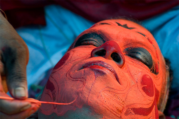 Long makeup sessions involves painting the face and body of oracle with vegetable dyes